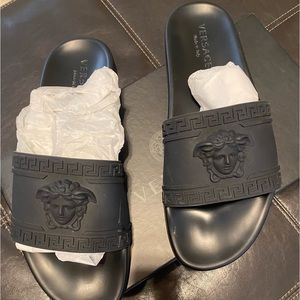 Men’s Versace slides still like new.Smoke free &pet free home.